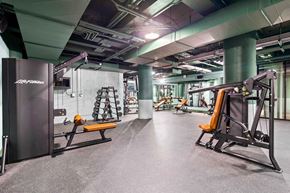 Minneapolis apartment for rent - a gym with weights and exercise equipment in a building