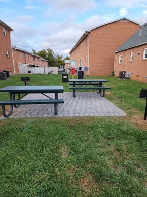 Winchester apartment for rent - A green picnic table is in the middle of a grassy area.