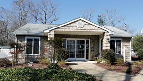 Newport News apartment for rent - A house with a grey roof and a white fence.