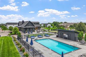 Maple Grove apartment for rent - A large house with a pool in the backyard.