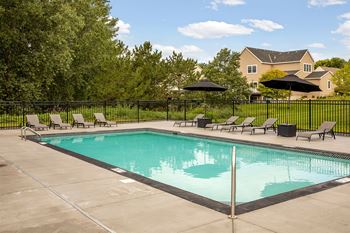 Resort-inspired pool with sundeck and lounge chairs