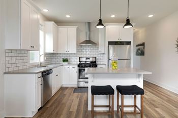 White shaker cabinets with matte black hardware