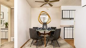 Denver apartment for rent - Dining area inside a classic apartment at Willowstone Apartments featuring ceiling fan and open access to kitchen