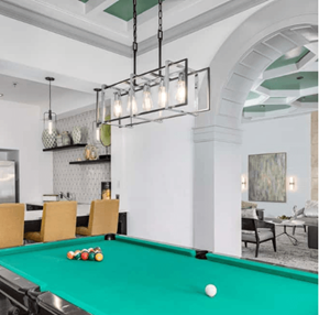 Woodbridge apartment for rent - Billiard room with a green pool table, racked balls, and modern lighting fixtures.