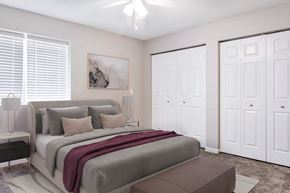 Springfield apartment for rent - A bedroom with a large bed and a painting on the wall.