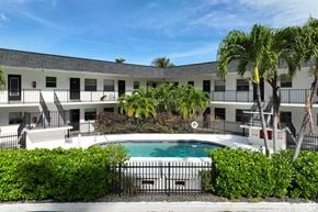 Ft. Lauderdale apartment for rent - Swimming pool at RTW Rentals in Fort Lauderdale featuring tropical landscaping, outdoor seating areas, and relaxing community gathering spaces.