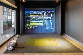 New Rochelle apartment for rent - 3thirty3 new rochelle ny apartment high rise photo of sports simulator with golf clubs and golf balls as well as other sports equipment