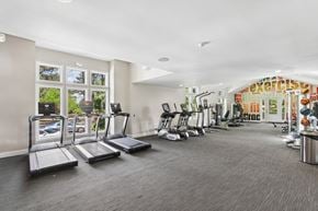 Lawrenceville townhouse for rent - A gym with treadmills, exercise bikes, and other equipment.