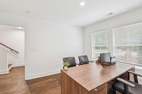 Avondale Estates townhouse for rent - A conference room with a long table, chairs, and a laptop.