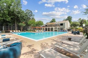 Norcross apartment for rent - Resort-style swimming pool surrounded by trees at Elliot Norcross pet-friendly apartments