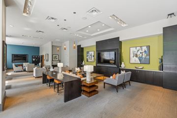 Atlanta apartment for rent - A modern living room with a grey sofa and a wooden coffee table.