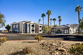 Las Vegas apartment for rent - a house on a street with palm trees in the background