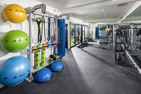 Las Vegas apartment for rent - a workout room with weights and other exercise equipment
