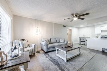Tempe apartment for rent - A living room with a grey couch and a coffee table.