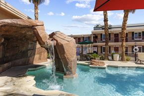 Las Vegas apartment for rent - a resort style pool with a waterfall and rocks
