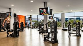 Henderson apartment for rent - A gym with a variety of equipment including treadmills, weights, and exercise machines.