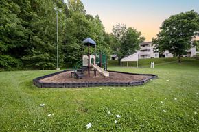 Winston Salem apartment for rent - Outdoor playground and green space at Sugar Creek Apartments Winston Salem