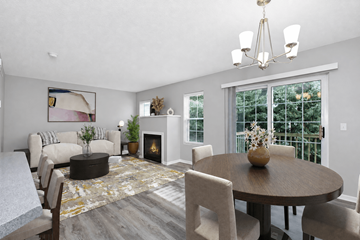 Burnsville townhouse for rent - A modern living room with a fireplace and a dining table set for four.