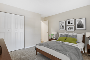 Peachtree City apartment for rent - a bedroom with a large bed and a closet