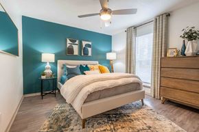 Charleston apartment for rent - The Jaunt Apartments in Charleston South Carolina photo of a bedroom with a bed and a ceiling fan