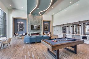 Grand Prairie apartment for rent - a game room with a pool table and a blue couch