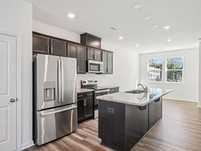 Raleigh apartment for rent - Modern kitchen with stainless steel appliances at The Maple townhomes Raleigh NC