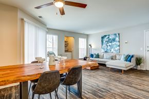 Glendale Heights apartment for rent - Apartments in Glendale Heights for rent - The Mark - living room with a dining room table and a couch