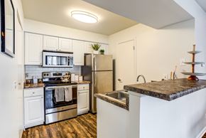 Glendale Heights apartment for rent - Apartments in Glendale Heights for rent - The Mark - kitchen with stainless steel appliances and a quartz counter top