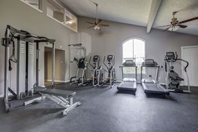 Harvey apartment for rent - Westchase Apartments in Harvey LA photo of fitness center with cardio equipment and strength training
