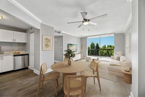 Wilton Manors apartment for rent - Dining area and open living space inside a renovated apartment at Wilton Tower in Wilton Manors, FL.