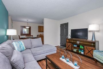 Wichita apartment for rent - a living room with a couch and a tv