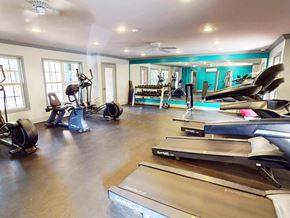 Lafayette apartment for rent - A home gym with treadmills, elliptical machines, and other exercise equipment.