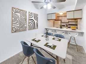 Waterford apartment for rent - a dining area with a table and chairs and a kitchen in the background