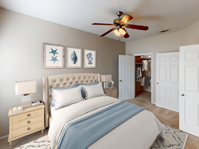 Lubbock apartment for rent - a bedroom with a bed and a ceiling fan