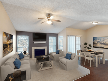 Lubbock apartment for rent - a living room with couches and a table and a ceiling fan