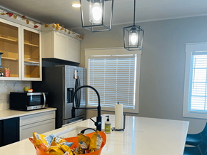 Guymon apartment for rent - a kitchen with white cabinets and a counter top