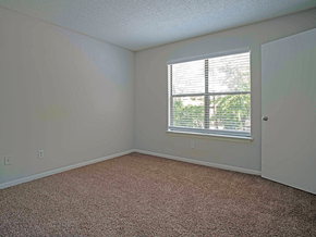 Little Rock apartment for rent - an empty bedroom with a window and carpet