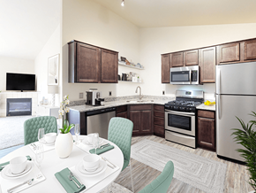 Grand Rapids townhouse for rent - a kitchen with stainless steel appliances and a dining table
