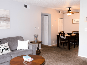Sioux City apartment for rent - A living room with a grey couch and a brown coffee table.