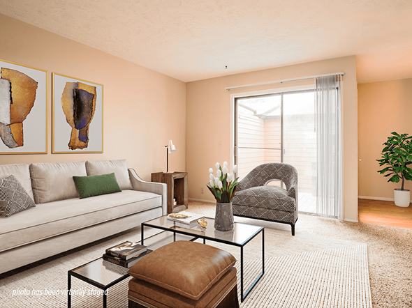 Omaha triplex for rent - A living room with sliding glass door to patio