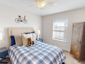 Birmingham apartment for rent - a bedroom with a bed and a bike on the wall