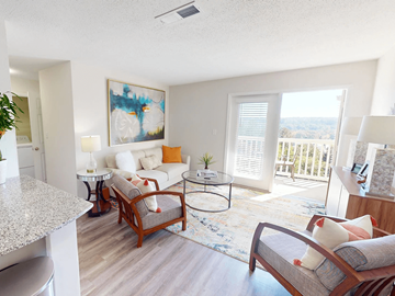 Birmingham apartment for rent - A living room with a couch, chair, and a painting on the wall.