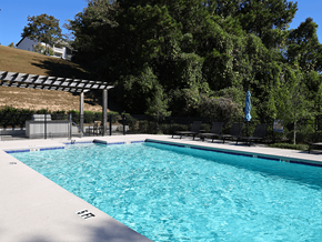 Birmingham apartment for rent - a swimming pool with black chairs and a resort style pool