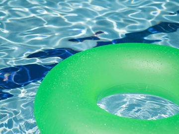 Birmingham apartment for rent - A green inflatable ring floating in a pool.