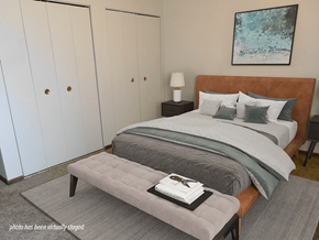 Minneapolis apartment for rent - A bedroom with a large bed and a painting on the wall.