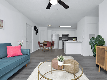 Fayetteville apartment for rent - A living room with a blue couch and a coffee table.