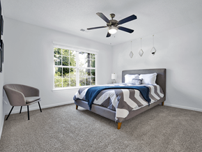 Fayetteville apartment for rent - Apartment bedroom with a bed, window, and ceiling fan