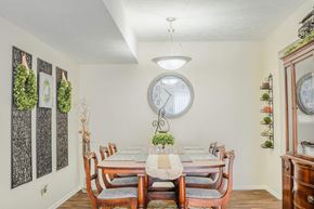 Omaha apartment for rent - A dining room with a table set for six people.