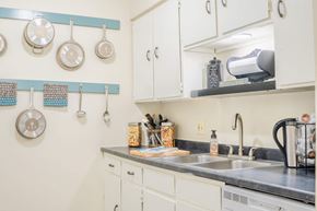 Omaha apartment for rent - A kitchen with a white counter and a sink.