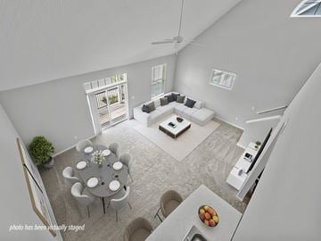 Ashland apartment for rent - A modern living room with a dining table set for six.